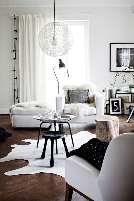 a faux sheepskin, faux fur and leather are ideal to make Scandinavian spaces catchier and cozier