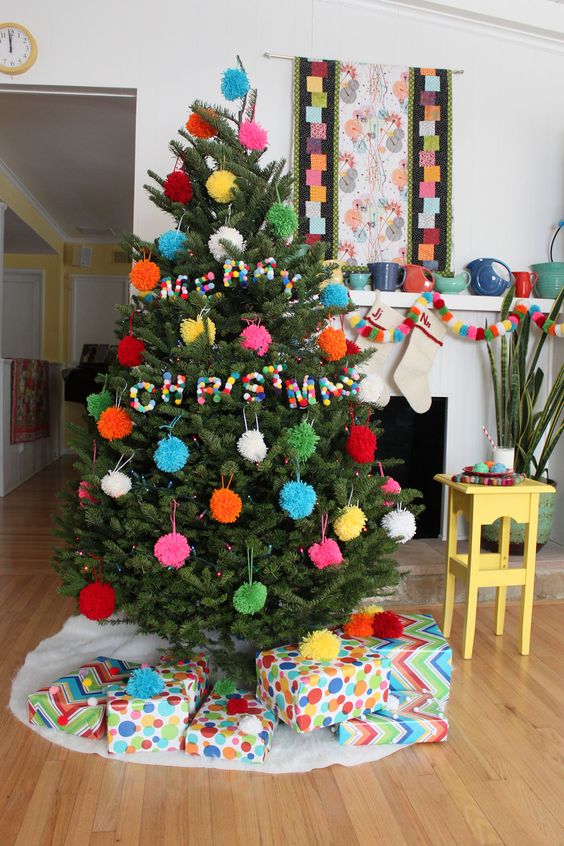 All pompom Christmas tree decor with ornaments and pompom letters for fun, so budget friendly