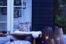 16 a Scandinavian space with lots of candle lanterns, pillows and faux fur for a real hygge feeling