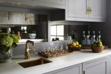 16 mirror backsplashes are a chic addition to a vintage kitchen, with brass fixtures you’ll get a refined look