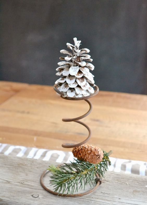 a snowy pinecone on a wire stand plus a usual one with evergreens cna be a nice rustic decoration