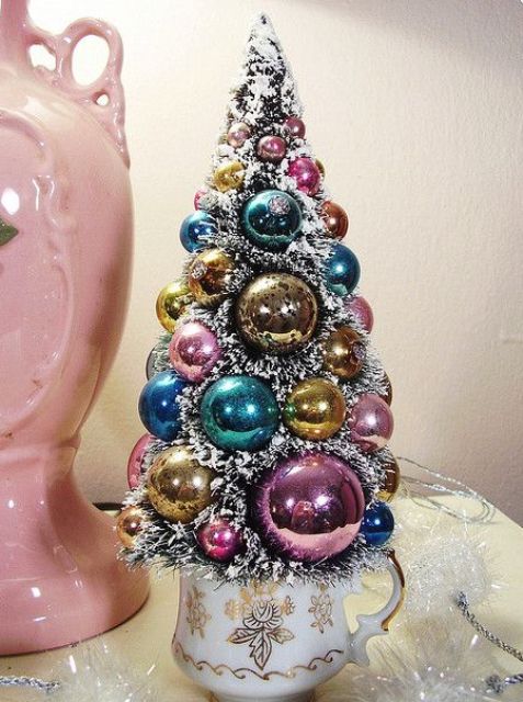 a chic pastel Christmas tree of ornaments with faux fur in between is a cool idea for a shabby chic interior