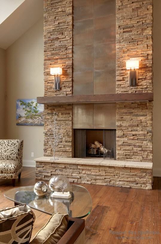 a faux stone clad fireplace with metal incorporated is ideal for a modern rustic living room