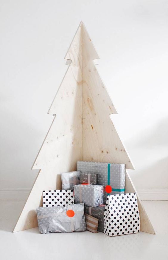 a simple plywood Christmas tree is great for Scandinavian spaces, it doesn't require any decorating at all