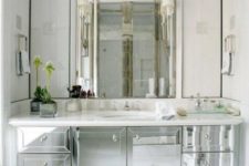 21 a mirror vanity like this one plus a large miror will make your mudroom or bathroom shine bright