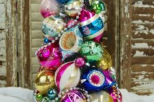 21 a super colorful and vintage Christmas tree made of ornaments and beads on a tray is a creative idea