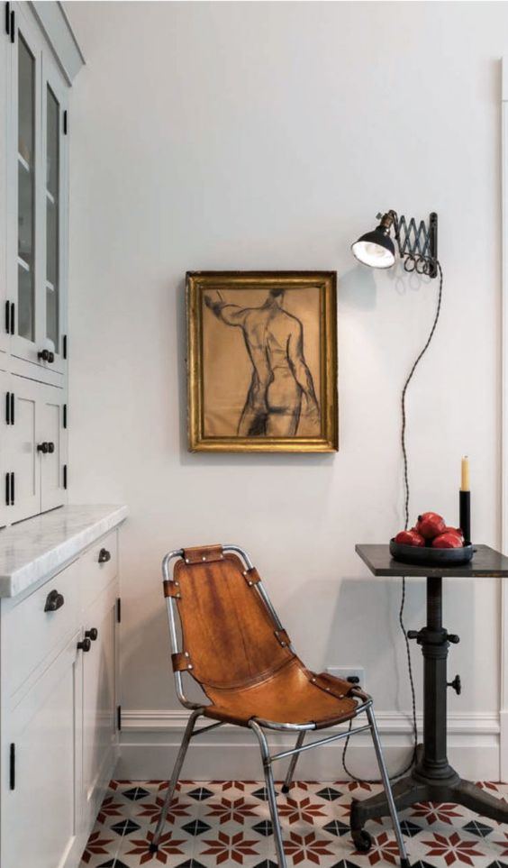 an industrial leather chair is a great way to add a masculine touch to your space, you can even DIY it