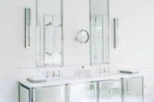 22 a minimalist solution with a mirrored vanity and two matching ones plus white marble everywhere around