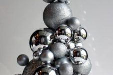 23 a whimsy Christmas tree of shiny and glitter silver ornaments can be easily DIYed and used as a tabletop one or a centerpiece