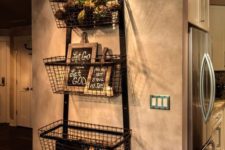 23 an industrial shelving unit made of metal strips and metal wire baskets in the entryway