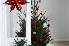 24 a small tree decorated with red and white ornaments is a gorgeous Scandinavian themed idea