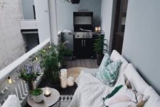 25 a cozy Nordic balcony with potted plants, printed textiles and a grill – all you need in one