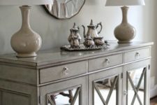 25 a vintage sideboard clad with mirror and with criss crosses for a refined and chic look