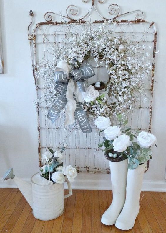 a snowy star branch wreath with a fake bird nest and a large ribbon bow and a fake bloom for shabby chic decor