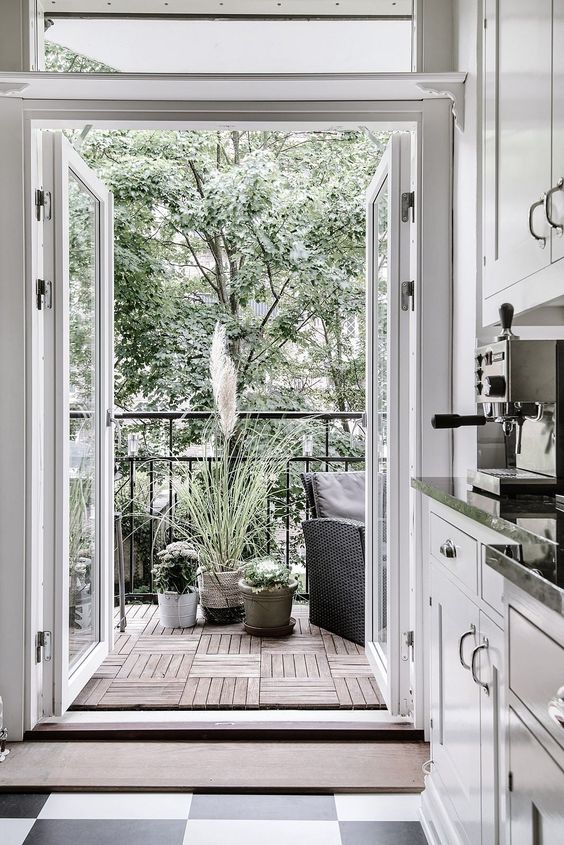extend your kitchen or another space with a balcony, add potted plants and comfy furniture