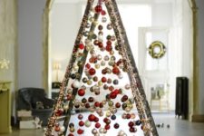 28 take a usual ladder and cover it with lights, then attach Christmas ornaments on various heights to form a creative tree