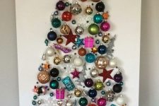a Christmas tree wall art made of bright vintage ornaments is always a good idea and a very refined decoration