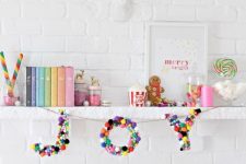 a banner with JOY letters made completely of colorful pompoms is a fun and cool idea to rock for Christmas