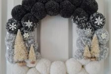 a grey and white ombre pompom Christmas wreath with mini snowflakes and bottle brush trees is awesome