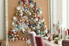 a large Christmas tree on canvas with a vintage frame is shaped only of colorful vintage ornaments for a chic look