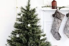 a modern Nordic Christmas tree with simple cardboard ornaments and metal wire ornaments that can be easily DIYed