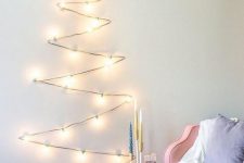a simple and fast to make light Christmas tree with a snowflake topper looks great and catchy
