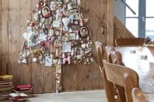 a wall art Christmas tree composed of ornaments, artworks and toys is a unique solution for a quirky space, it looks amazing