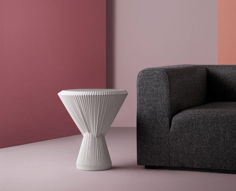 This unique modern side table is called Plisago and it's made of porcelain yet looks like of fabric