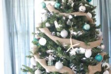 rustic-looking christmas tree with burlap decor