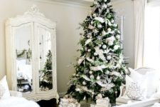 02 a winter wonderland space with lots of white fur, a silver and white Christmas tree and white furniture