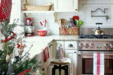 03 a neutral kitchen was spruced up with reds and evergreens and looks very natural and holiday-like