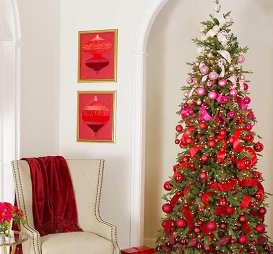 a beautiful and bright ombre Christmas tree from light pink to hot pink and red and burgundy plus lights