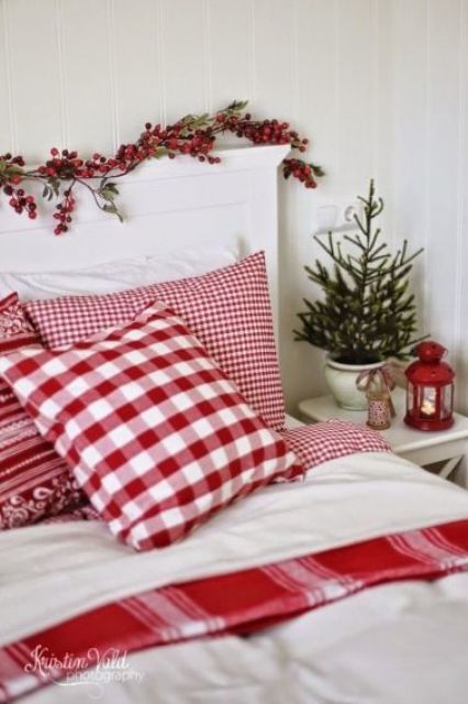 a bedroom in whites can be refreshed with holiday reds, berries, a lantern and even traditional bedding