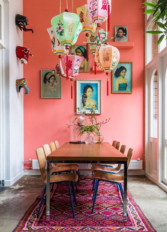 a coral pink statement wall is great for a boho and gypsy interior with eastern influence like this one
