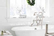 04 hang a small and cute wreath on the window, add a couple of deer over the bathtub and holidays are here