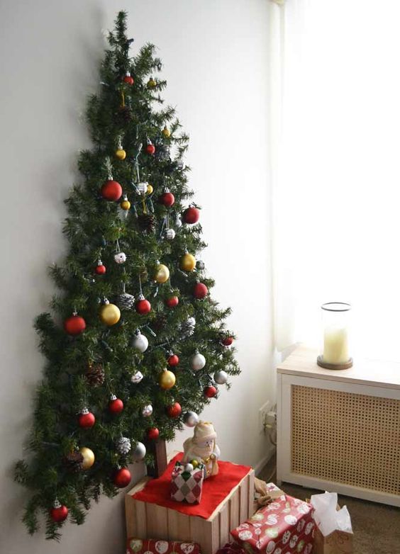 try various creative ideas, for example, a wall-mounted Christmas tree, which won't take much space