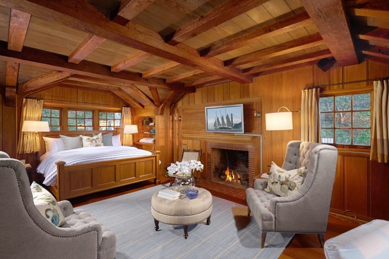 The bedrooms looks like out of a movie, with much teak wood and grey and light blue linens and upholstery
