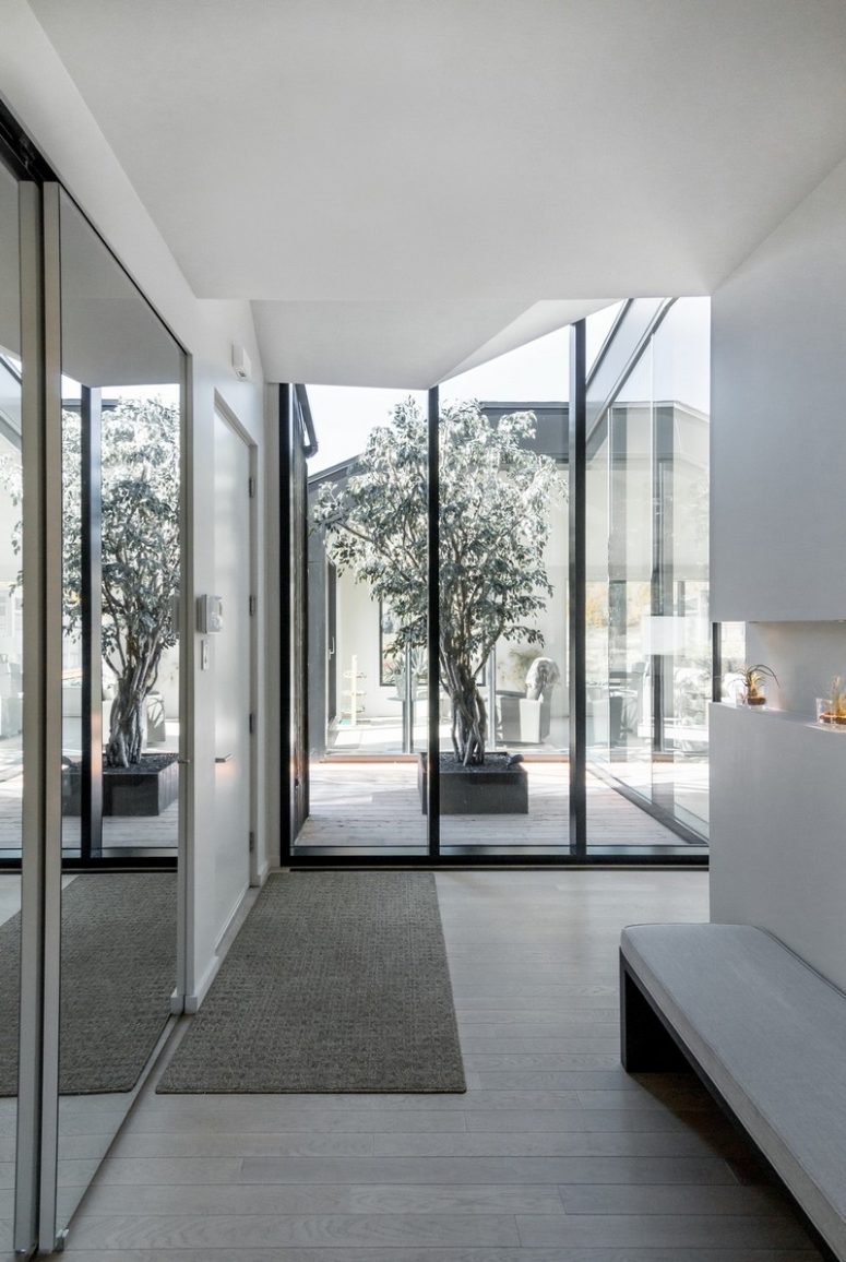 The spaces of the house enjoy much natural light and amazing views plus entrances to the multiple terraces