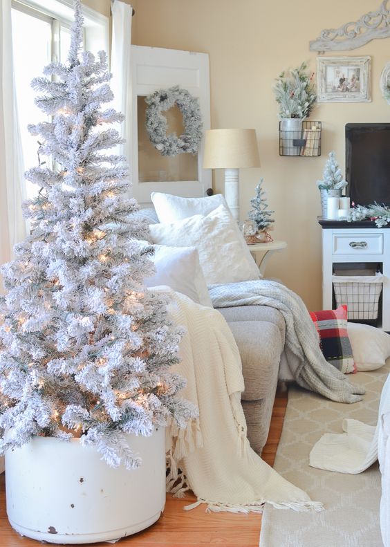 a snowy white Christmas tree like this one doesn't require any decor, just add lights and it's beautiful