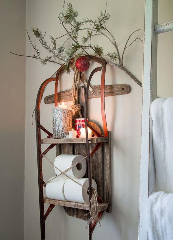 use a vintage sleigh as a shelvign unit on a wall, add candles, ornaments and evergreens