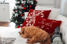 06 several red pillows and stockings plus ornaments are enough to make your space more holiday-like