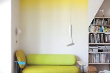 07 a bright ombre statement wall from yellow to neutrals and a matching neon yellow couch for a cool breakfast nook