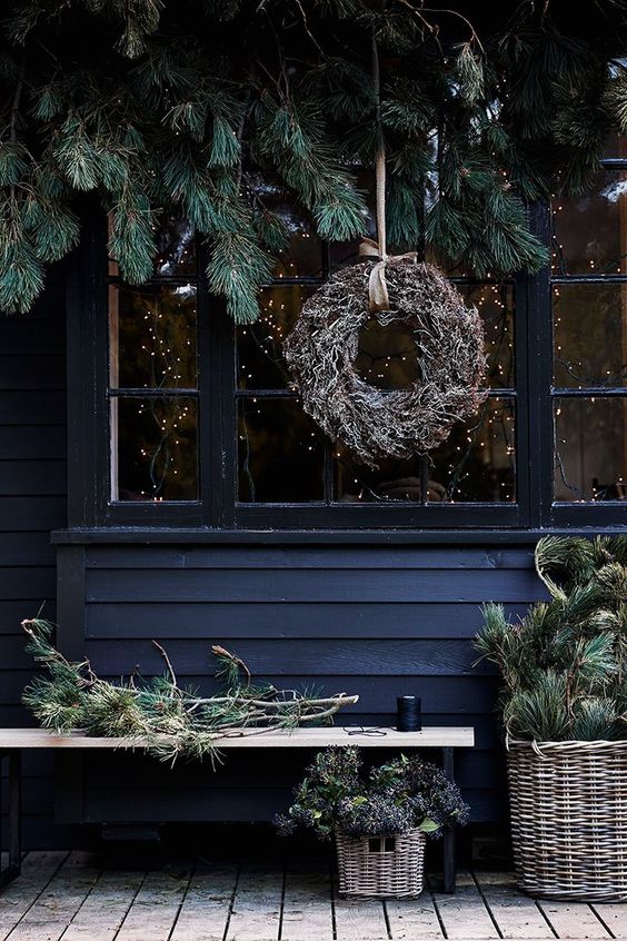 coordinate your indoor and outdoor decor, rock evergreens and a dried herb wreath to make your outdoor space hygge, too
