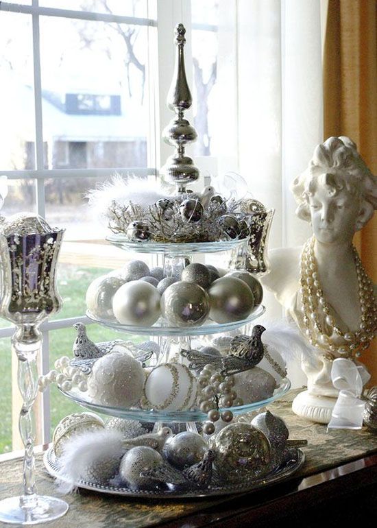 silver and white Christmas decor is a cool color scheme, which is neutral enough and has enough impact
