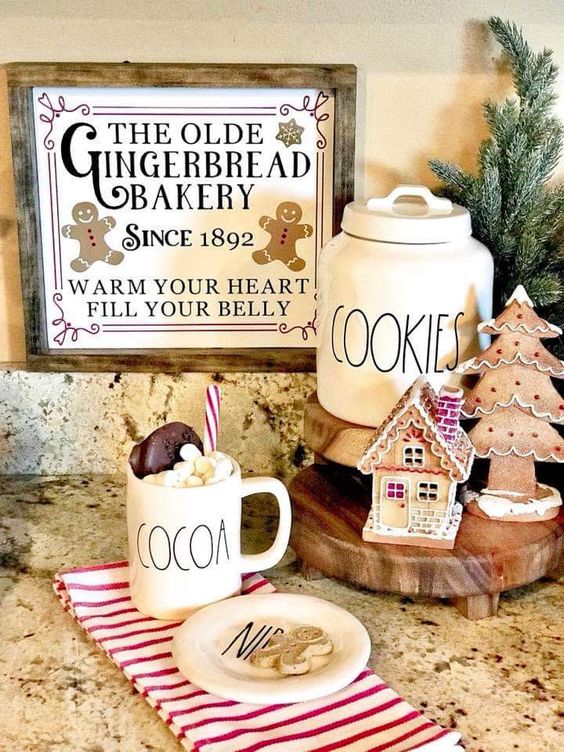 a little gingerbread station with a gingerbread tree and house plus a vintage sign