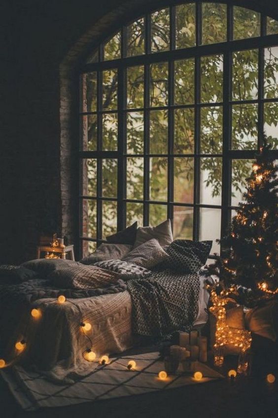 You can make any bedroom Christmassy with lights   a lit up tree, a lit up deer and vintage lights