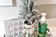09 a single and simple festive display with metallic touches is a gorgeous idea to rock for Christmas bathroom decor