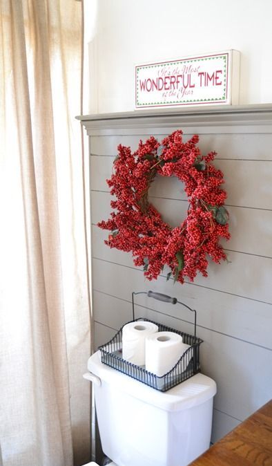 a fake berry wreath is a cute and nice idea, which can be used even in a bathroom to bring festive spirit in
