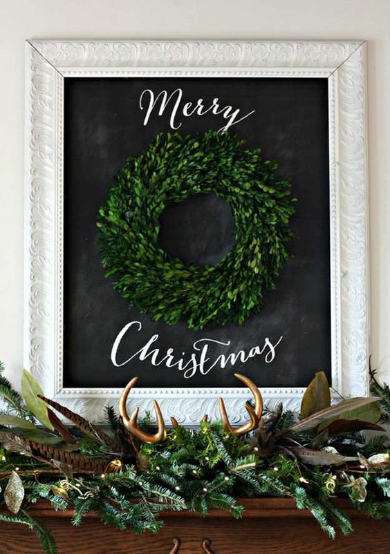 a boxwood Christmas wreath and a lush evergreen garland with lights, foliage, feathers and fake antlers