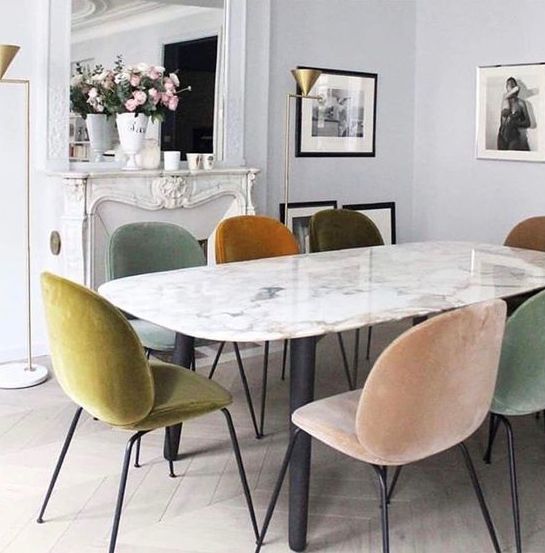same chairs in mismatched muted tones make this dining space much more interesting